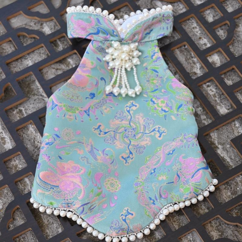 Paws Trendy Pet Spring & Summer Qipao for Dogs & Cats, suitable for Teddy, Bichon Frise and other small dogs. Features embossed fabric with exquisite retro frog buttons, fine workmanship, exuding noble elegance and making your beloved pet stand out.