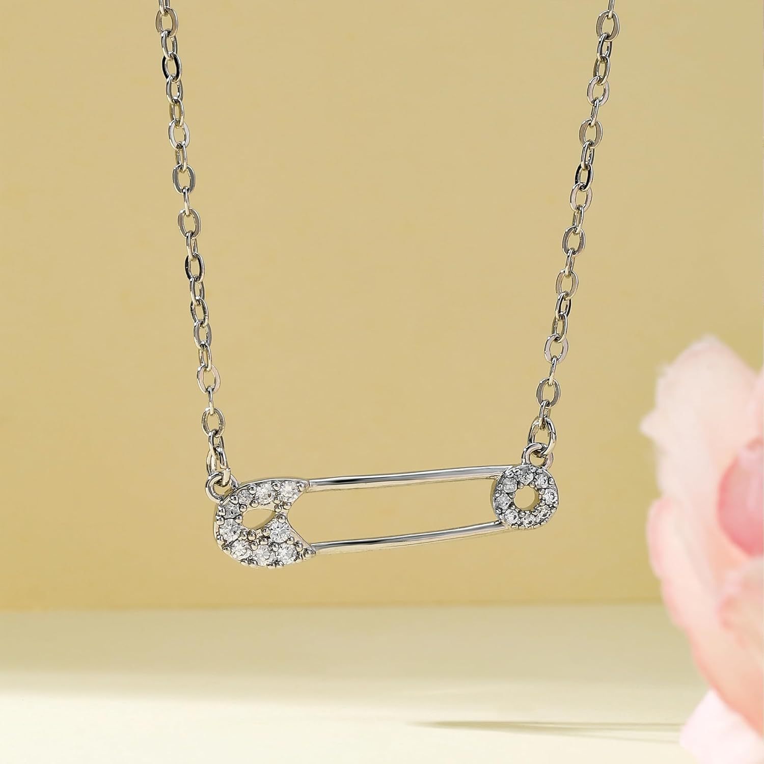 A Stylish Necklace Collar for Women Featuring Safety Pins niki safety pin necklace