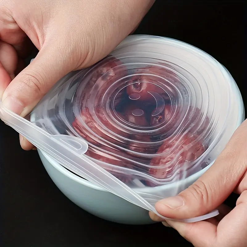 6 reusable and durable silicone stretch lids for food storage bowls. These silicone lids are dishwasher and refrigerator safe, ideal kitchen supplies.