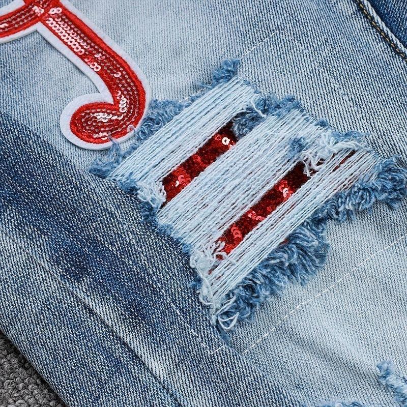 YYK Brand: Street-Style Distressed, Skinny-Fit Stretch Jeans-Featuring Patches, Embroidery, and a Vintage Denim Aesthetic-Showcasing Casual and Fitness-Inspired Styling
