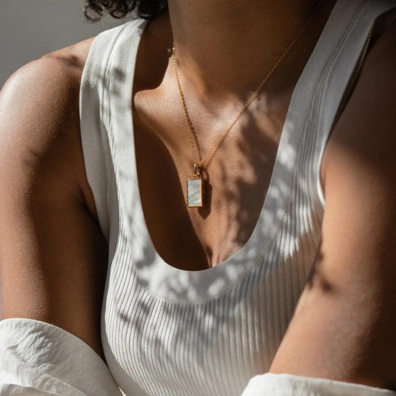 Pearl Locket Necklace by Caitlyn Minimalist.
