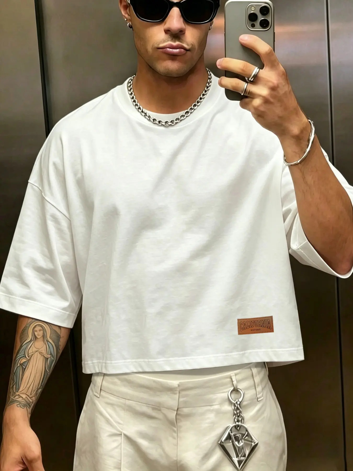 Men's T-shirt featuring a short, loose fit with dropped shoulders; made from 100% Sorona polyester fabric and accented with a minimalist small leather logo. An essential basic—perfect for hot summer vacation outfits. Casual tee