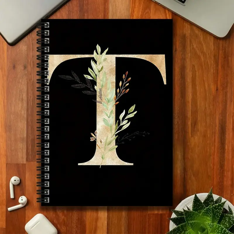 A simple black and gold floral spiral-bound notebook, featuring a cover with gold lettering paired with fresh green plants, exuding an elegant style. Suitable for work records, study notes, and also makes a beautiful gift for graduation ceremonies, birthd