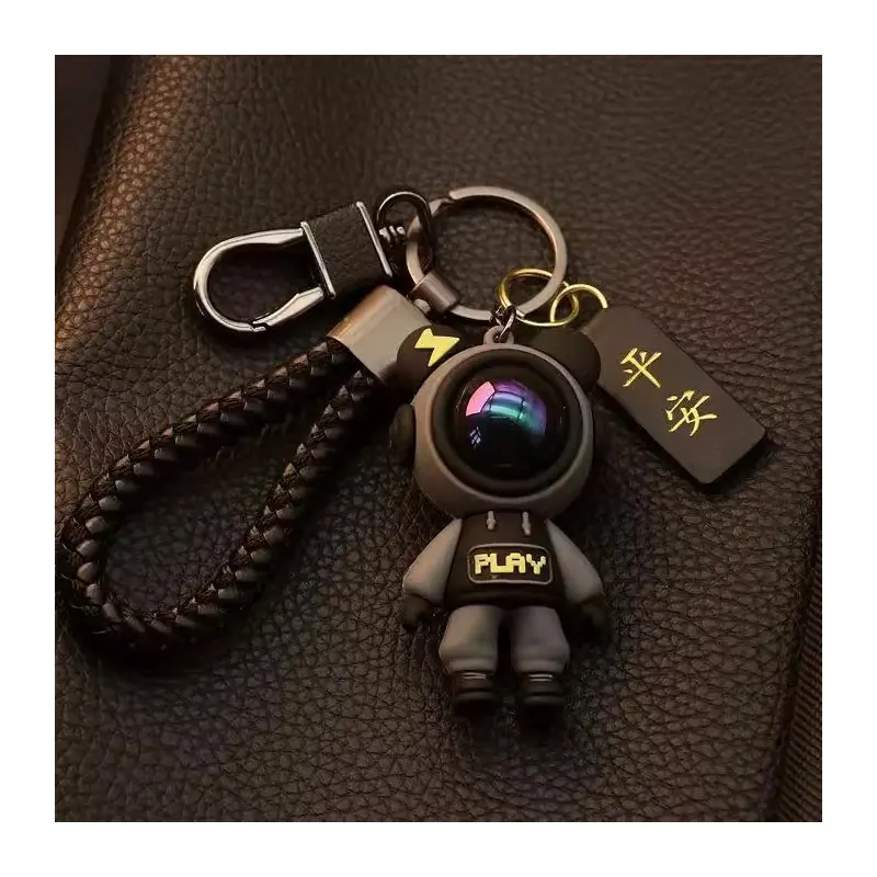 Cute Cartoon Astronaut Keychain for Car Keys, Pink One-eyed Astronaut Doll Key Ring with Braided Leather Strap, Decorated with Lucky Charm Tag, Fun 3D PVC Figure Key Pendant, Comes with Metal Key Ring and Lobster Clasp, easy to attach to car keys, backpac