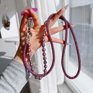 Luxury diamond-encrusted phone case lanyard, crossbody, neckband, wristband, three-in-one multi-functional necklace, portable wristband, pearl fashion, high-end, durable telephone cord, double buckle new style lanyard