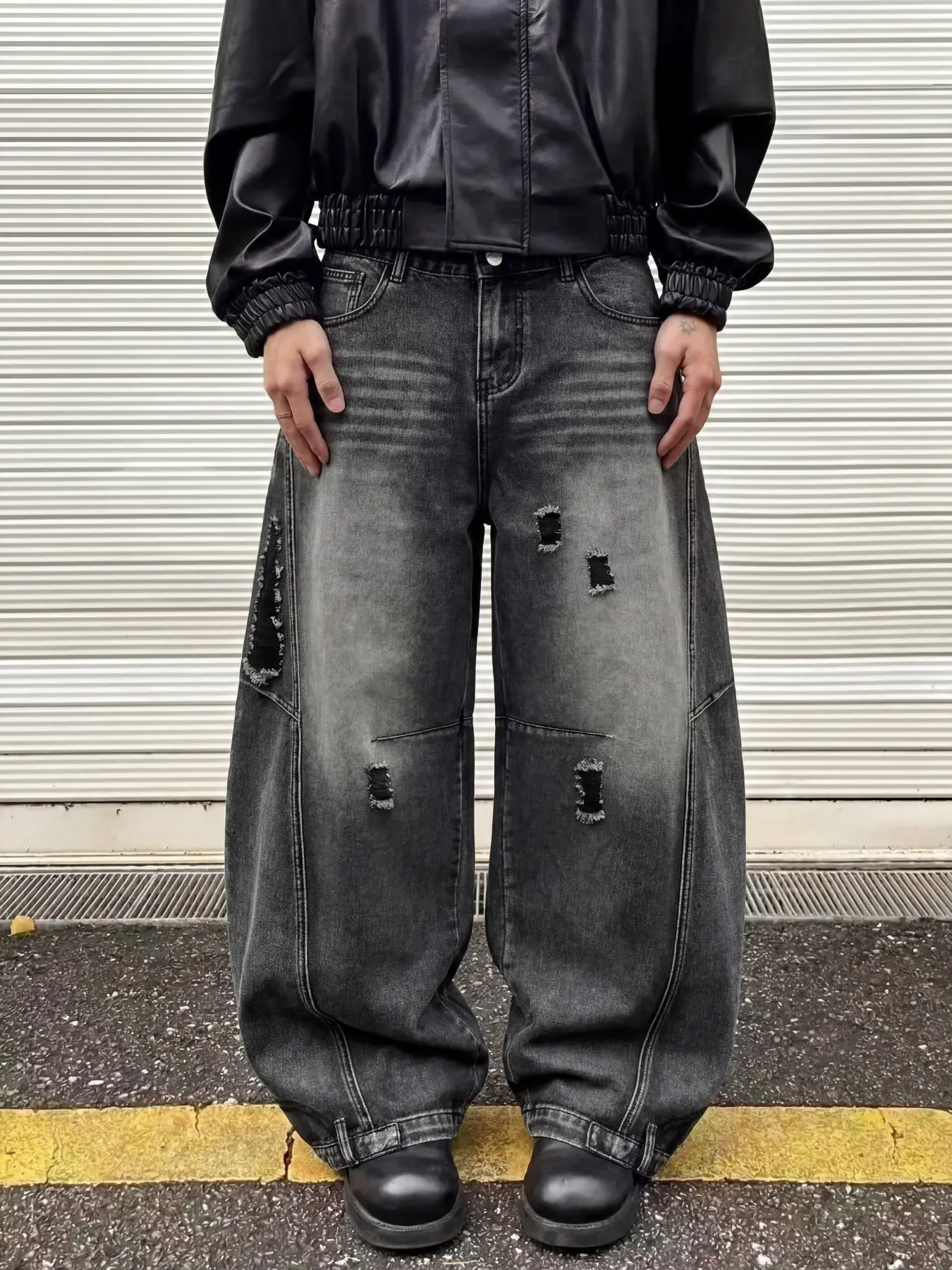 Men's black and gray distressed patchwork and curved blade-style jeans with oversized baggy wide-leg loose stacked floor-length design, perfect for all leg shapes—essentials for streetwear enthusiasts