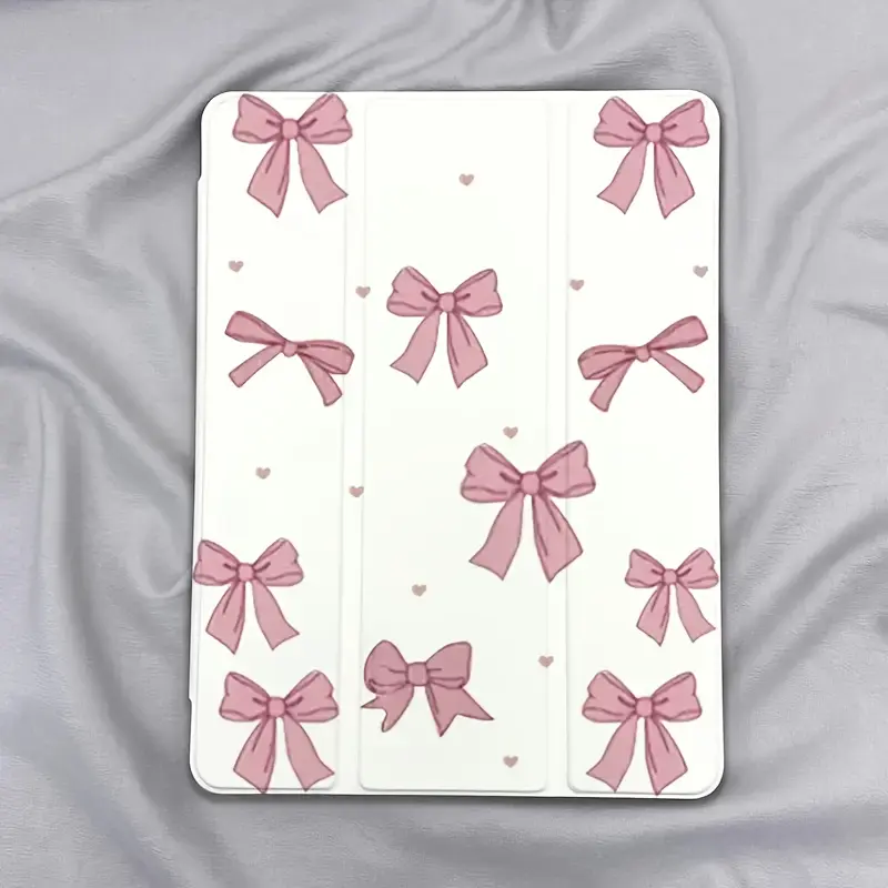 Soft pink bow-patterned protective case featuring an adjustable stand and stylus holder; a foldable, non-slip TPU cover compatible with Samsung, iPad mini, iPad Air, iPad Pro, and iPad (10th/11th Gen) series.