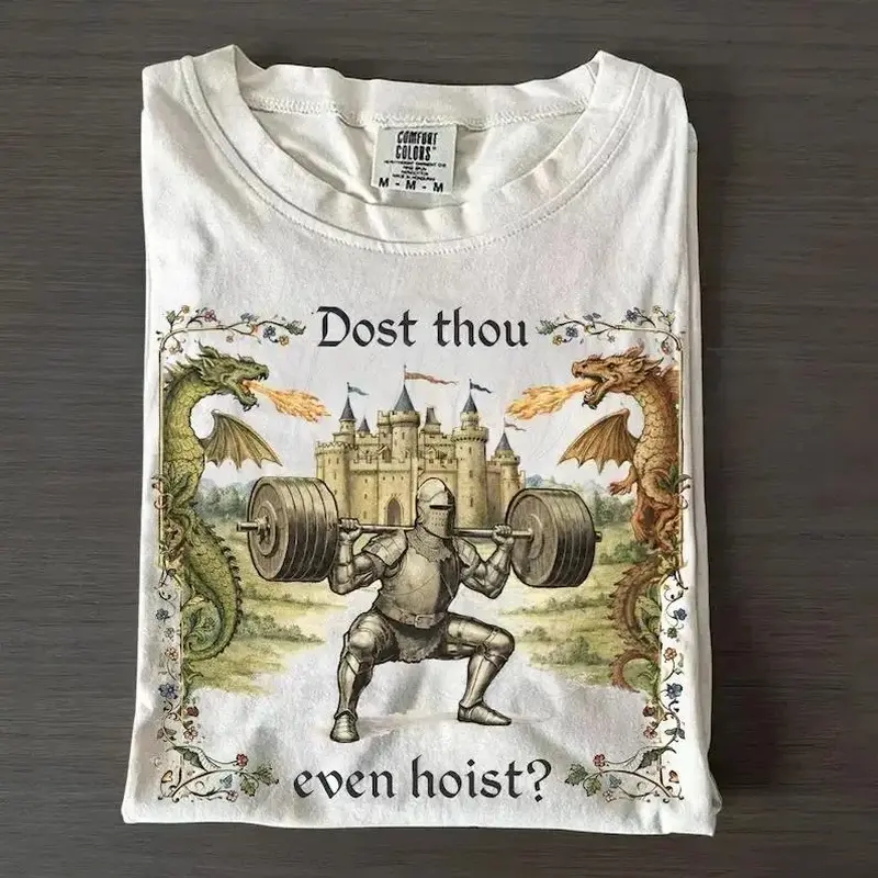 Vintage Dost Thou Even Hoist Graphic Tee |   Retro Medieval Knight Aesthetic T-Shirt |   Heavyweight 100% Cotton Fun Gym Top |   Trendy Ren Faire Relaxed Fit Apparel |   Unique Gym Rat Fitness Gift |   Edgy Urban Streetwear Outfit