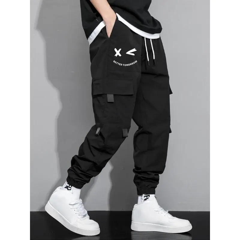 Men's cartoon face and letter print drawstring waist overalls, casual regular fit practical jogging pants, four seasons men's trousers, menswear