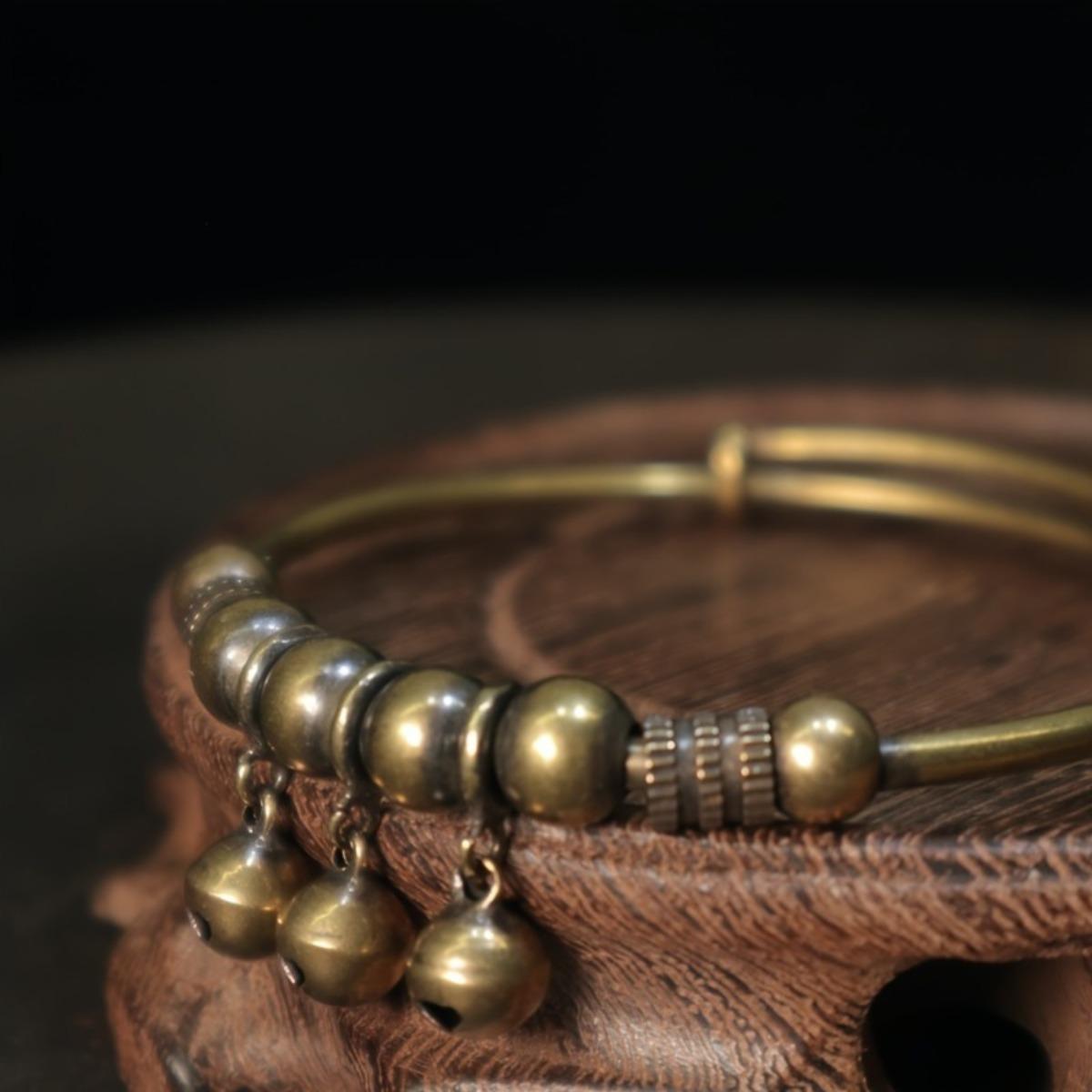 A vintage-style geometric bell braceletâan accessory designed to soothe the mind and alleviate stress. Featuring a convenient push-and-pull adjustable design, this bracelet symbolizes wealth and good fortune, serving as a vessel for heartfelt blessings. A vintage-style geometric bell braceletâan accessory designed to soothe the mind and alleviate stress. Featuring a convenient push-and-pull adjustable design, this bracelet symbolizes wealth and good fortune, serving as a vessel for heartfelt blessings.