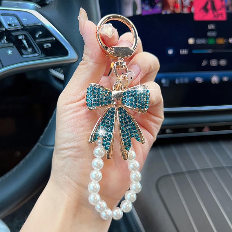 Rhinestone Bow Keychain with Pearl Wrist Strap, Luxury Bling Bow Car Key Ring, Elegant Metal Bag Charm Accessory for Women