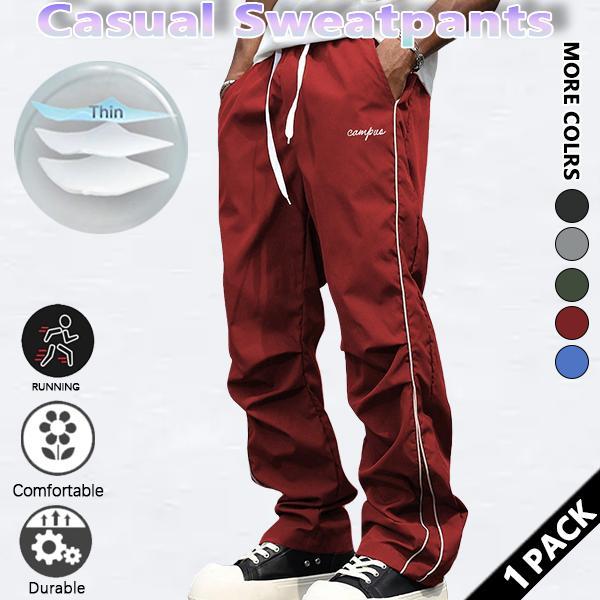Loose-fitting sweatpants for men, grey side stripes with gold accent stripes, comfortable design, sports casual style bottoms, sweatpants, fitness wear, today's fashion outfit Loose-fitting sweatpants for men, grey side stripes with gold accent stripes, comfortable design, sports casual style bottoms, sweatpants, fitness wear, today's fashion outfit