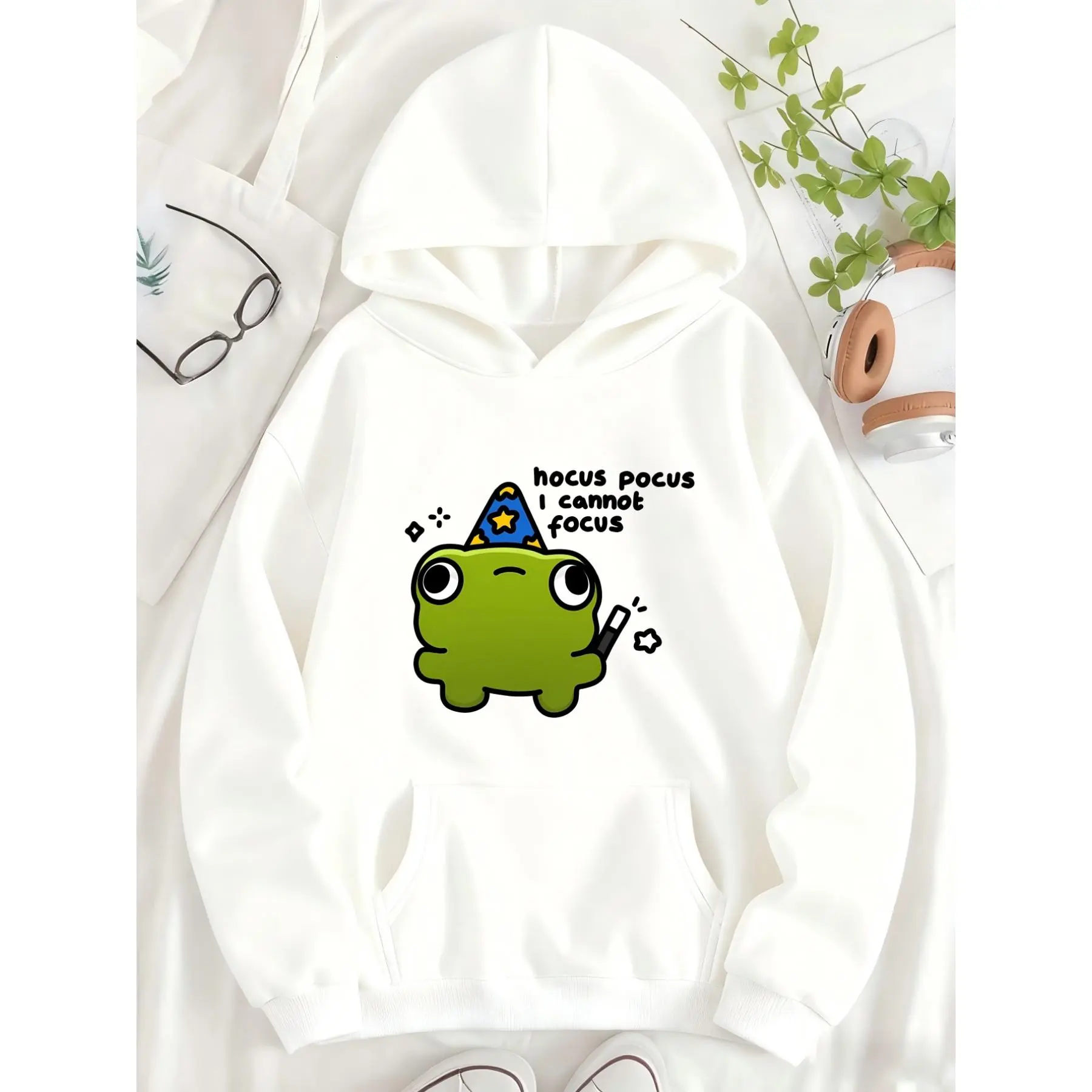 Cute Frog Wearing a Wizard Hat, Holding a Magic Wand, with a Fun Printed Design. Women's -lined Hooded Sweatshirt with a  Pattern and Printed Letters on the Pocket