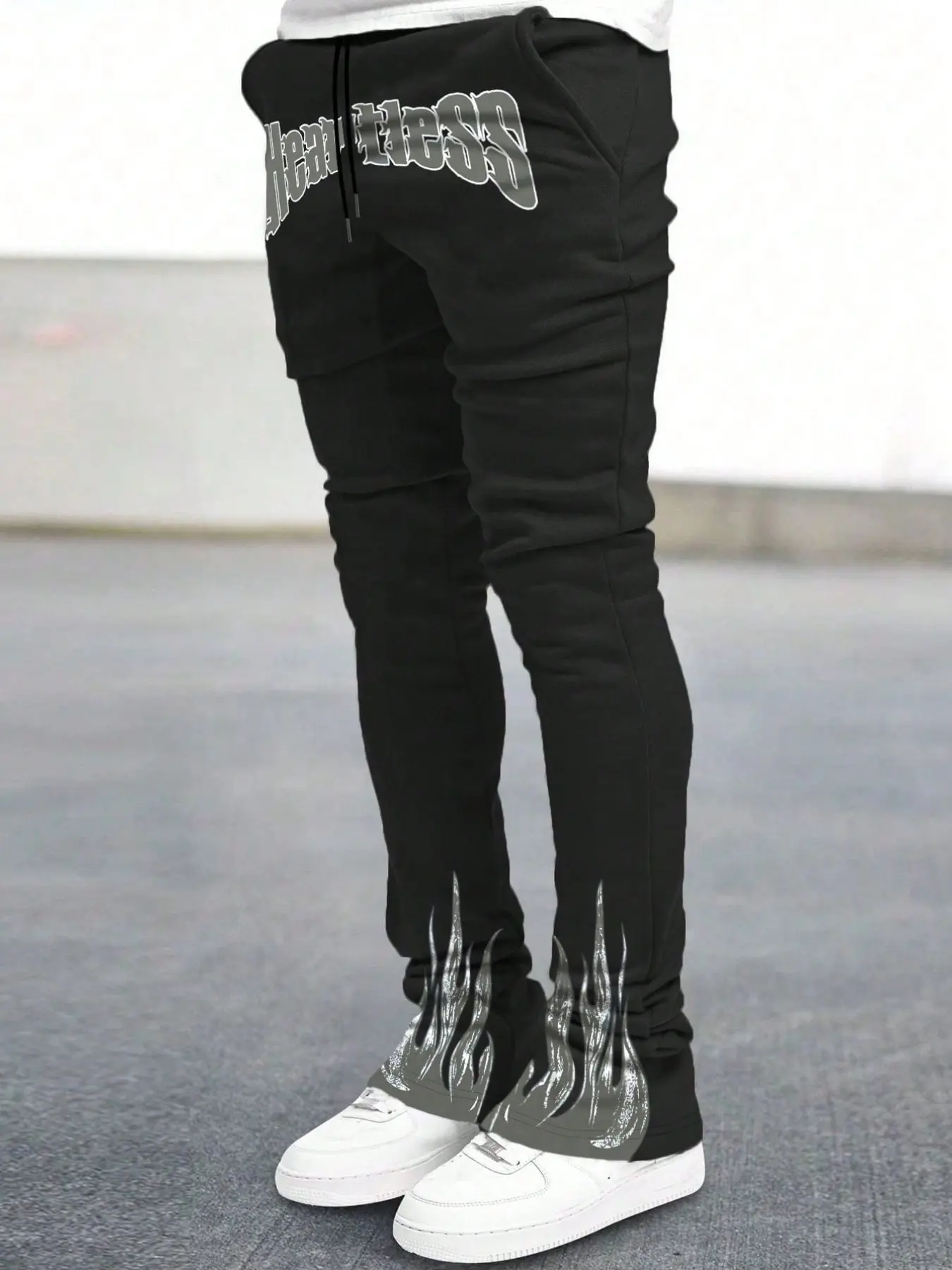 Men's Black Heartless Gothic Block Letter Sweatpants | Vintage Distressed Flame Print Hem Elastic Drawstring | Slim Flared Y2K Street Casual Track Pants for Men