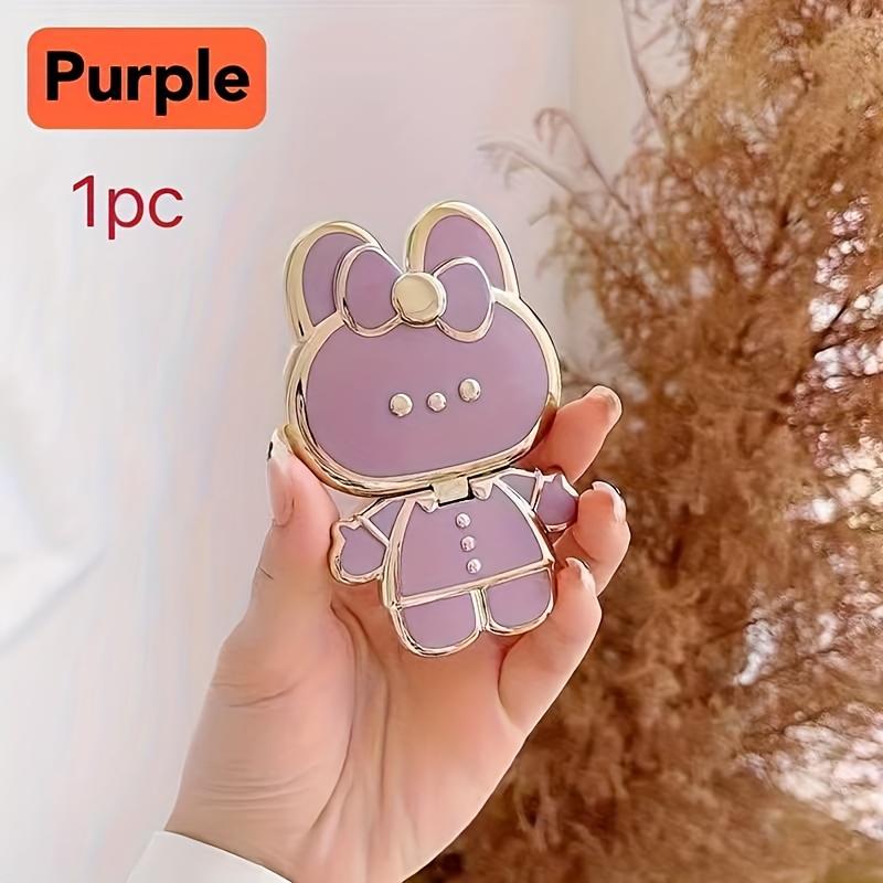 New rabbit-shaped adhesive phone stand with makeup mirror is suitable for iPhone, Samsung, Xiaomi phones, and various other phones. The rabbit phone case desktop stand is a hollow-out lazy stand