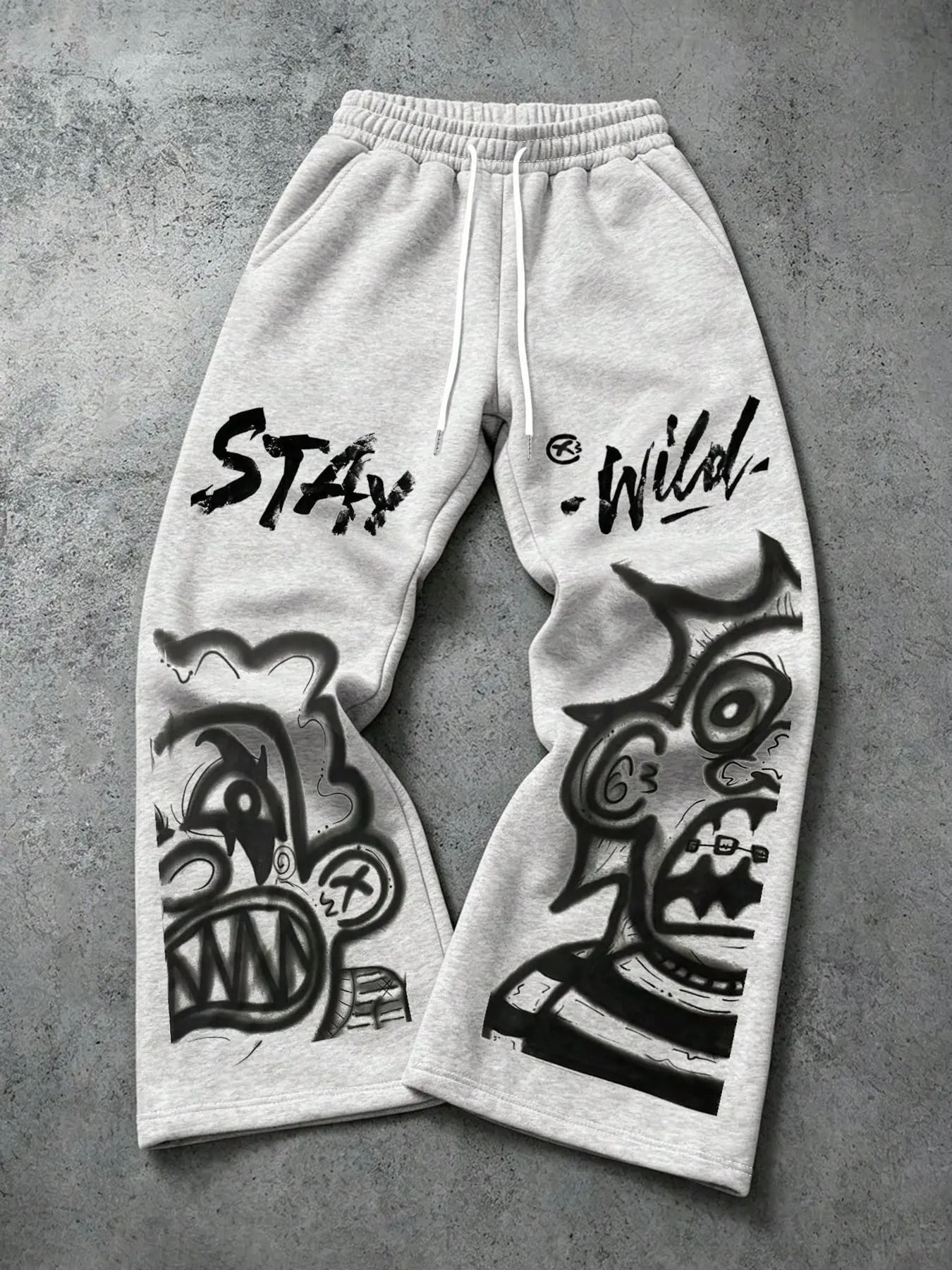 Vintage Underground Graffiti Cartoon Monster Graphic Wide Leg Sweat Pants Men Oversized Baggy Heather Grey Joggers Stay Wild Brush Font Print Stretch Rib Drawstring Waist Soft Fleece Relaxed Streetwear Trousers Trendy Gen Z Urban Skate All Season Casual P