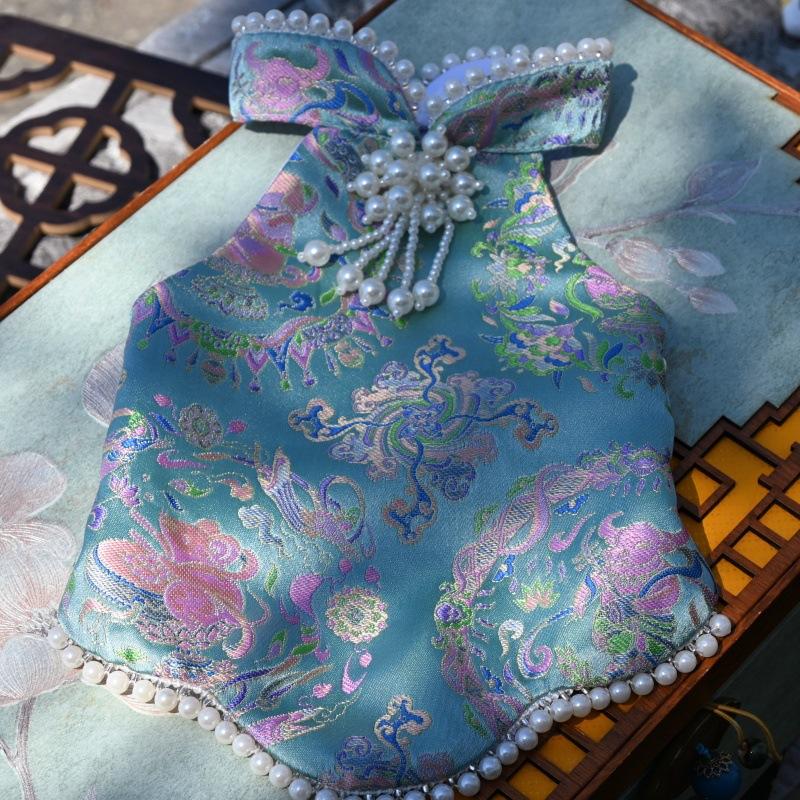 Paws Trendy Pet Spring & Summer Qipao for Dogs & Cats, suitable for Teddy, Bichon Frise and other small dogs. Features embossed fabric with exquisite retro frog buttons, fine workmanship, exuding noble elegance and making your beloved pet stand out.