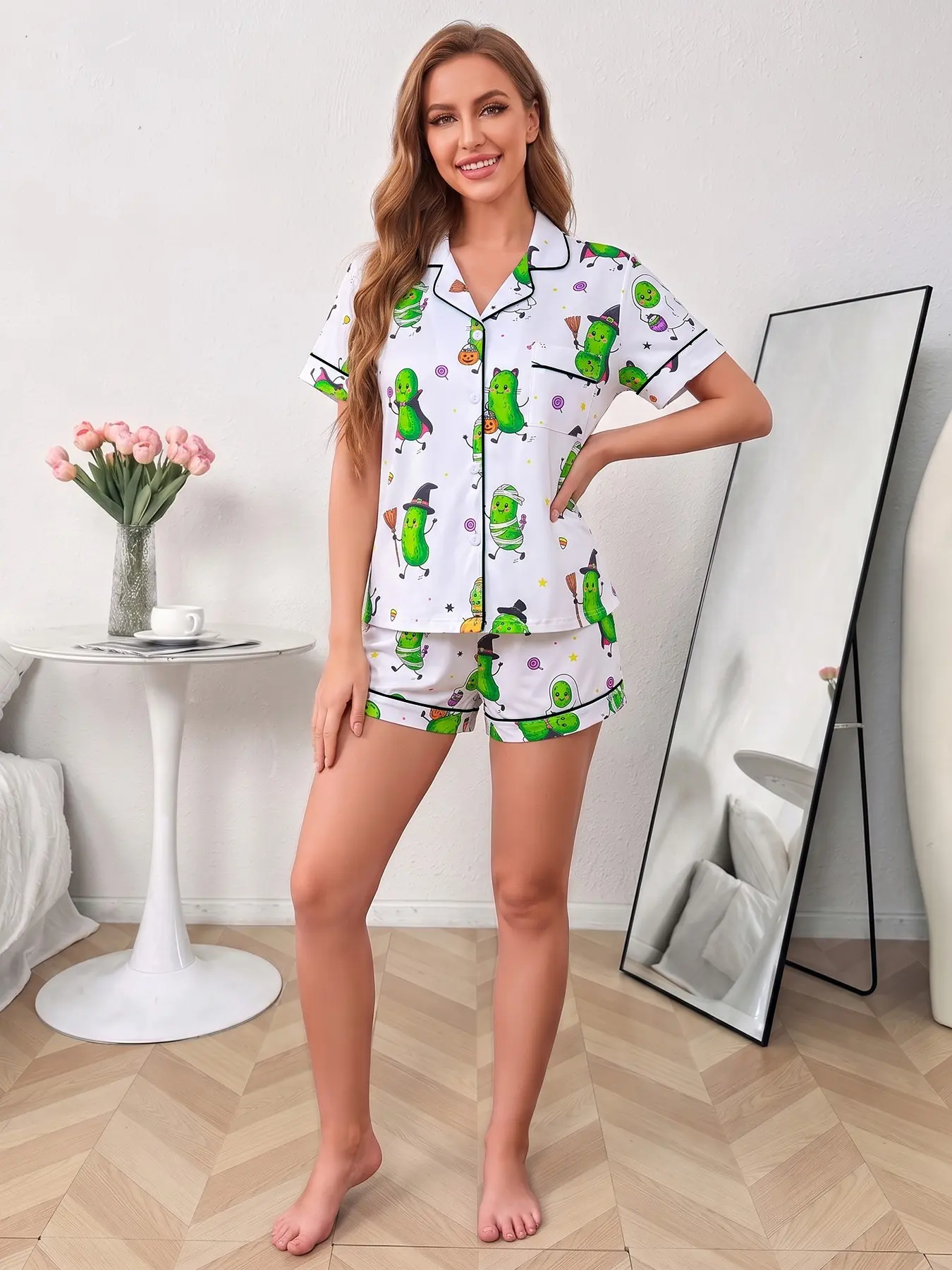Women's 2-piece pajama set, white base with funny Halloween pickle prints in mummy, witch & vampire looks, decorated with pumpkins and candies. Green piping lapel top with pocket, elastic waist shorts, comfy all-season women Halloween loungewear