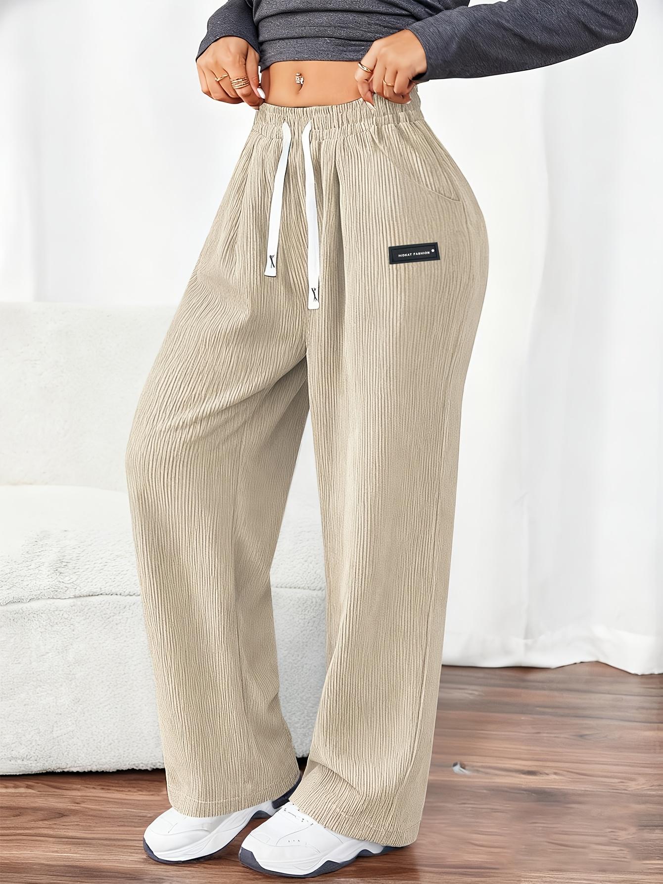 Women's Corduroy Jogger Pants for Spring and Autumn, featuring solid colors with drawstring pockets. Crafted from soft and comfortable fabric, these pants are ideal for everyday casual wear.