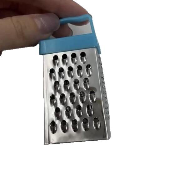 Multifunctional stainless steel household tool for peeling garlic, slicing vegetables and fruits, and shredding potatoes