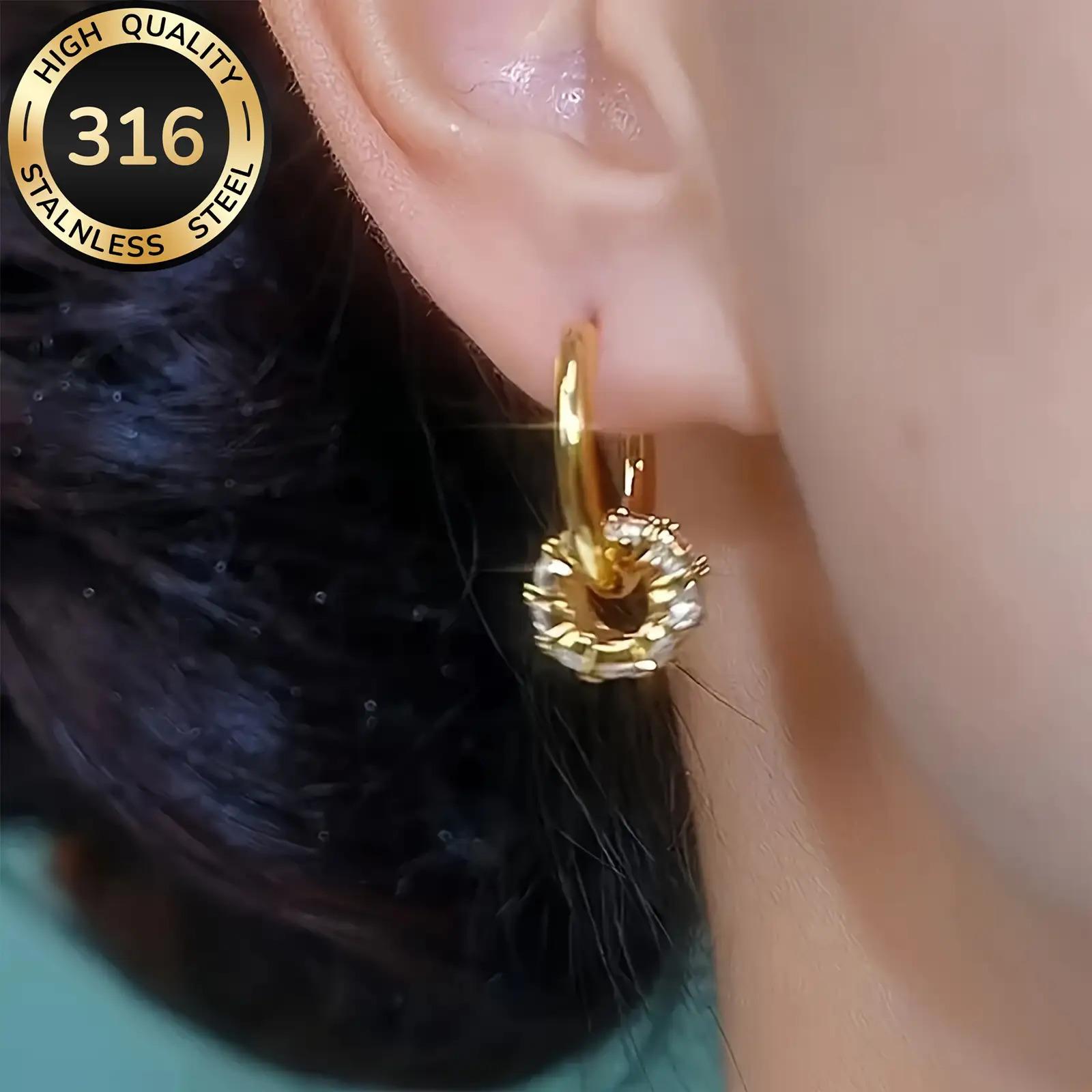 A pair of luxurious hoop earrings made of hypoallergenic 316 stainless steel with synthetic zirconia stones, featuring a minimalist design, a jewelry gift for women.