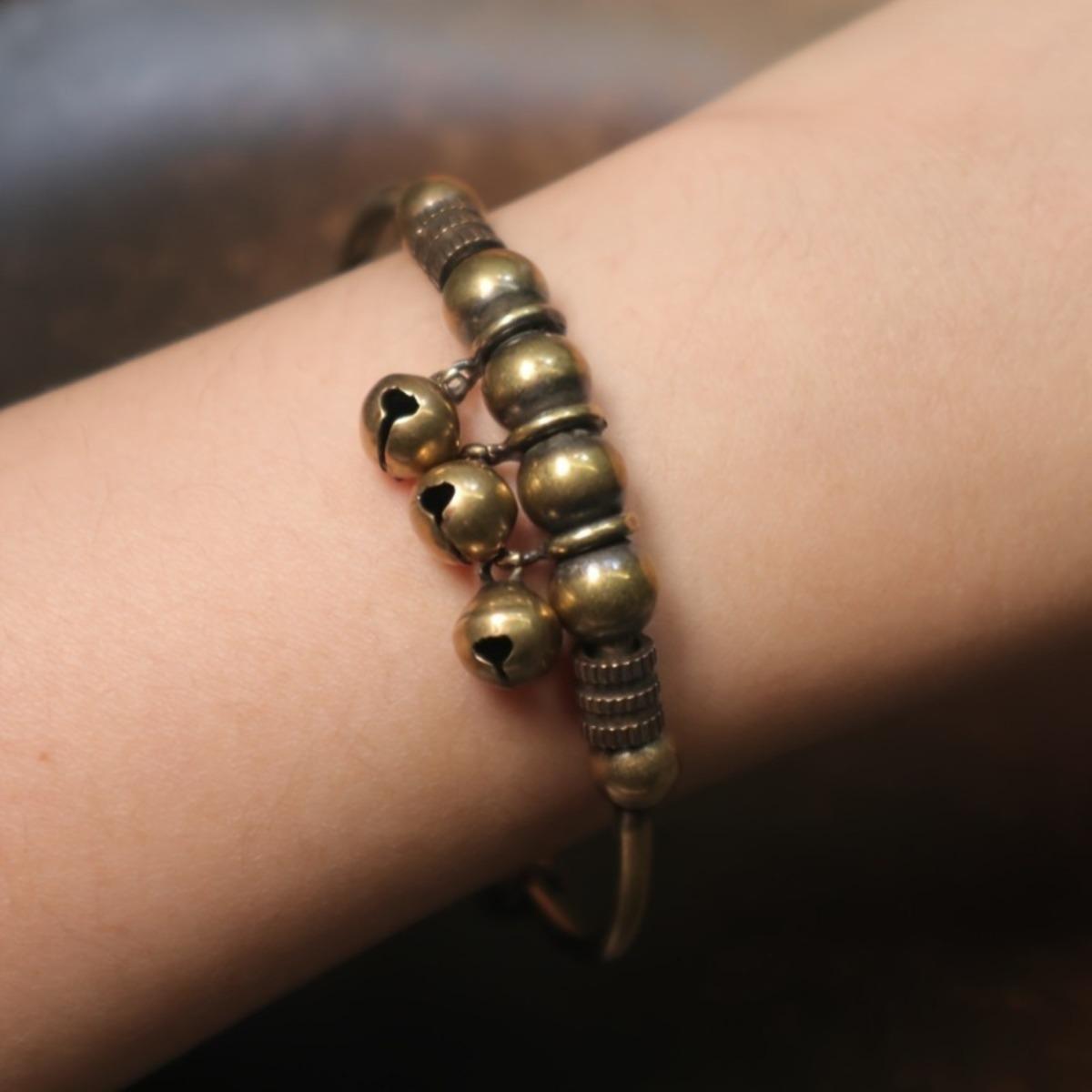 A vintage-style geometric bell braceletâan accessory designed to soothe the mind and alleviate stress. Featuring a convenient push-and-pull adjustable design, this bracelet symbolizes wealth and good fortune, serving as a vessel for heartfelt blessings. A vintage-style geometric bell braceletâan accessory designed to soothe the mind and alleviate stress. Featuring a convenient push-and-pull adjustable design, this bracelet symbolizes wealth and good fortune, serving as a vessel for heartfelt blessings.