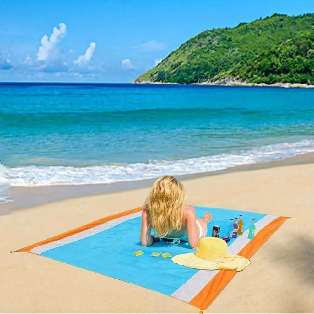 The portable sand blanket, Lightweight Picnic Mat, includes 4 ground studs and a storage bag, suitable for ultra portable picnics, beaches, hiking, camping parks, and music festivals. It is a must-have for vacations, Camping Supplies