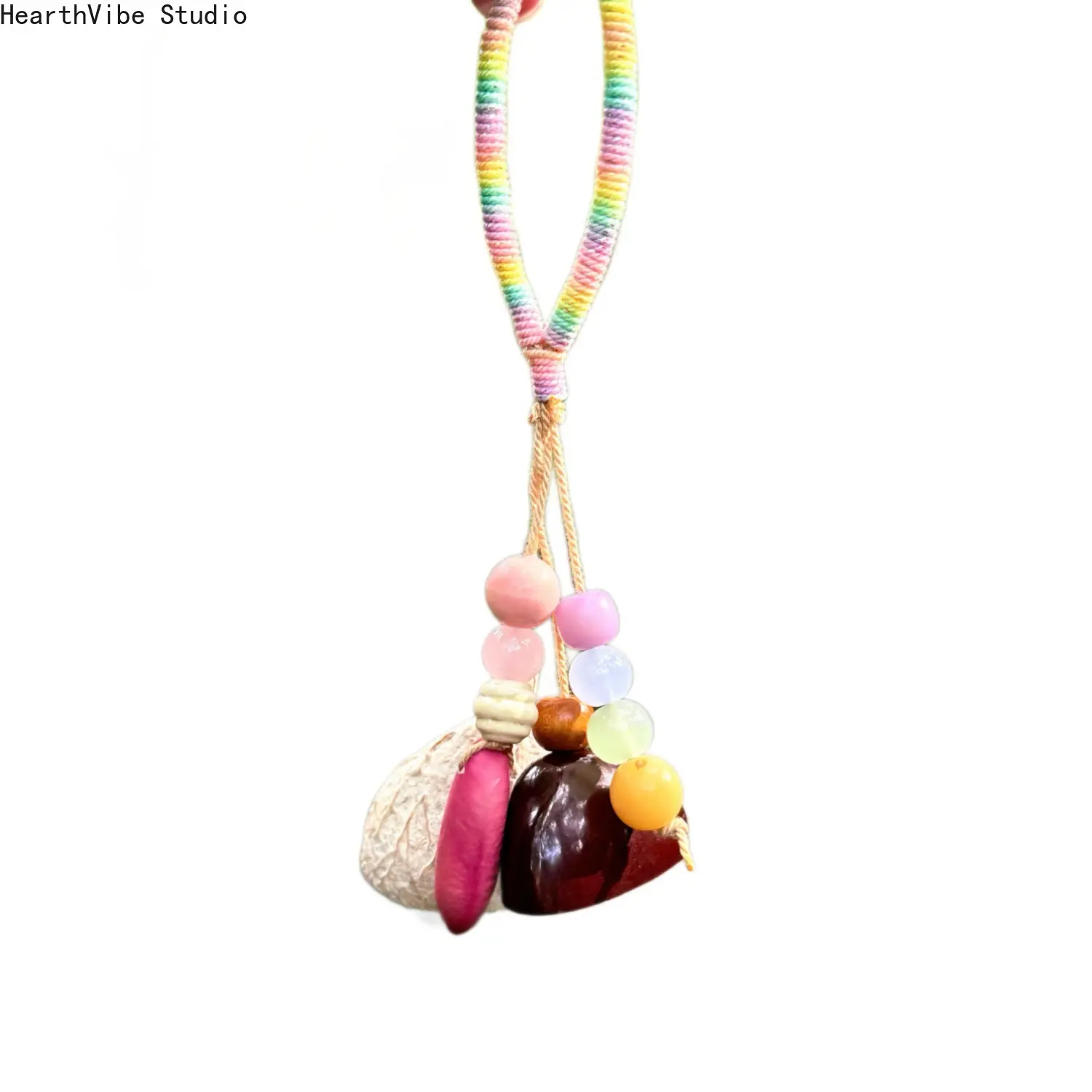 Handmade natural fruit-shell wind chime charm—a soothing, stress-relieving accessory for bags or keys that doubles as a botanical sound-therapy ornament.
