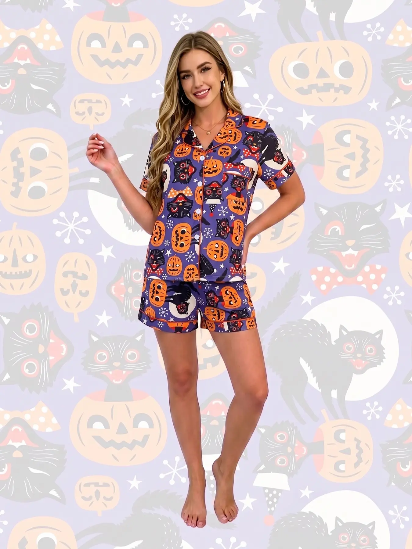 Women's 2-piece pajama set, purple base Halloween prints. Black cats, jack-o'-lanterns, moons and stars. Retro cartoon holiday style. Orange trim, lapel top with pocket, elastic waist shorts, soft comfy all-season women's loungewear