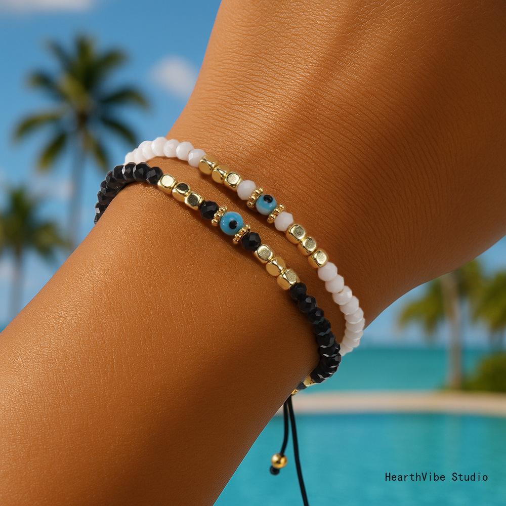 "Eye of the Demon" Couples' Bracelets: Black & White Crystal Beaded Set (2 Pieces) — Versatile, Hand-Woven Wristbands