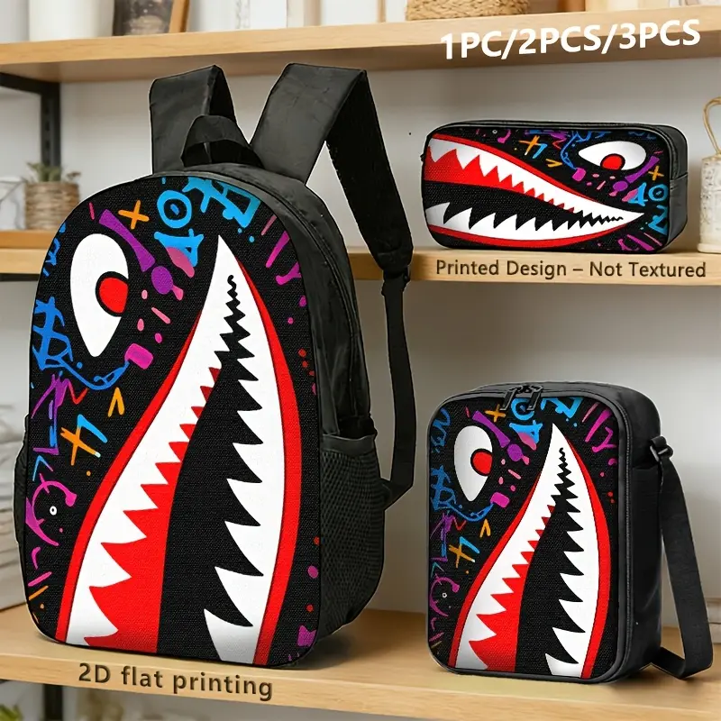 1/2/3-Piece Set (Black Backpack, Lunch Bag, Pencil Case): Featuring a bold, graffiti-style design with shark teeth, a wide-open mouth, and colorful numbers and symbols. With its striking, expressive style, this set is perfect for school, commuting, street