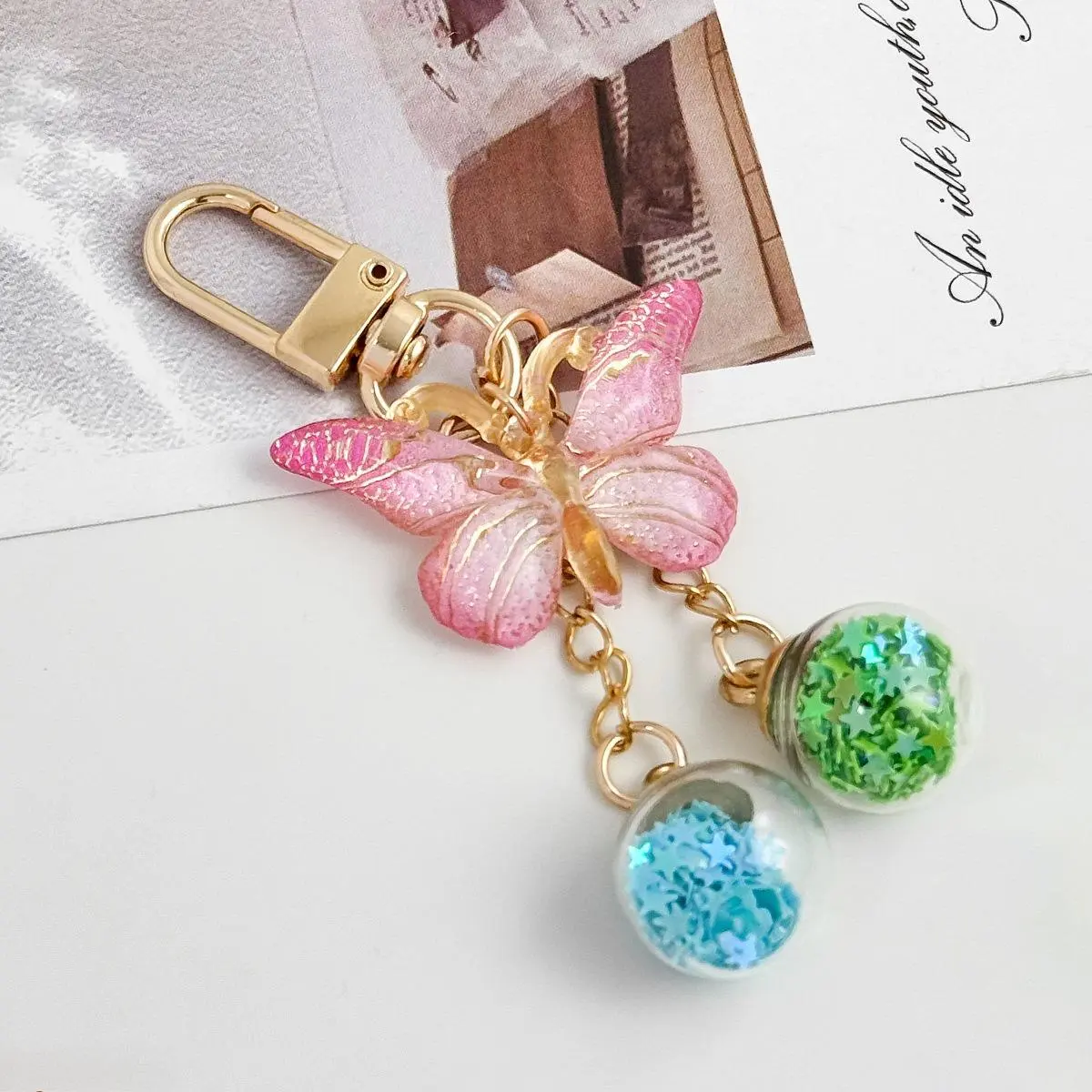2026 New Gradient Holographic Butterfly Dual-Color Quicksand Ball Keychain - Unisex Rust & Deformation Resistant, Smooth Polished Surfaces, Dreamy Floating Sand Decor, Thoughtful Graduation Commemorative Gifts, Grad Party Favors