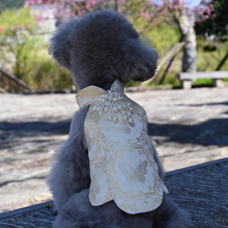 Paws Trendy Pet Spring & Summer Qipao for Dogs & Cats, suitable for Teddy, Bichon Frise and other small dogs. Features embossed fabric with exquisite retro frog buttons, fine workmanship, exuding noble elegance and making your beloved pet stand out.