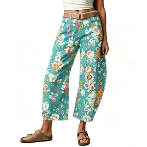 Women's vintage-wash wide-leg jeans; Y2K-style loose-fitting trousers; soft pink base with a bohemian floral print; suitable for year-round outdoor activities and streetwear styling.
