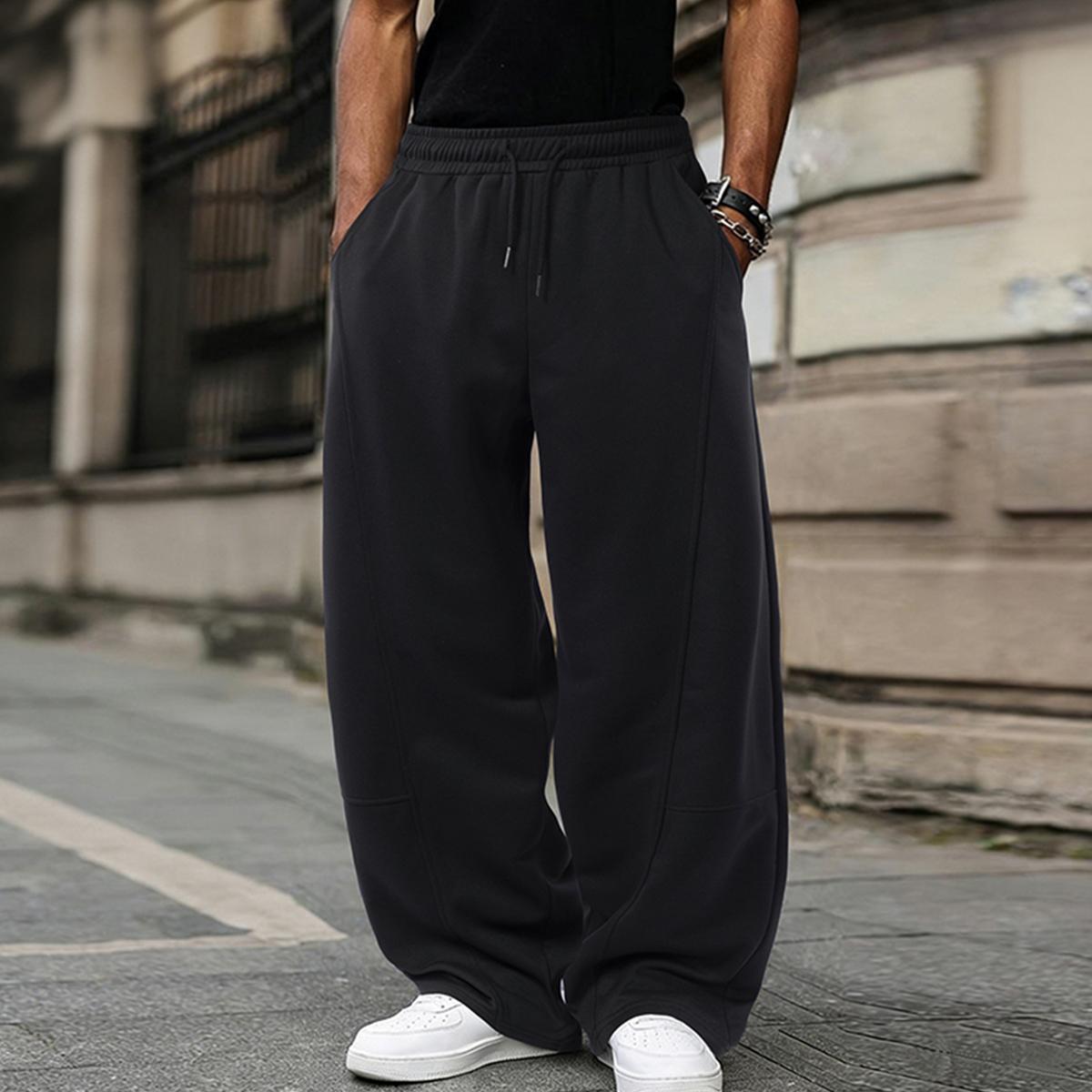 Men's solid color casual pants with an adjustable drawstring waistband. Stylish yet casual, comfortable and versatile, loose fit, suitable for all seasons, combining streetwear and sporty style