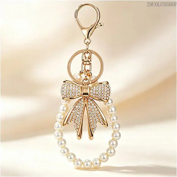 Elegant Bling Rhinestone Bow Bag Charm Keychain for Women, Imitation Pearl Chain Shiny Handbag Purse Pendant, Trendy Cute Sparkly Wallet Accessory, Perfect Holiday Gift for Her