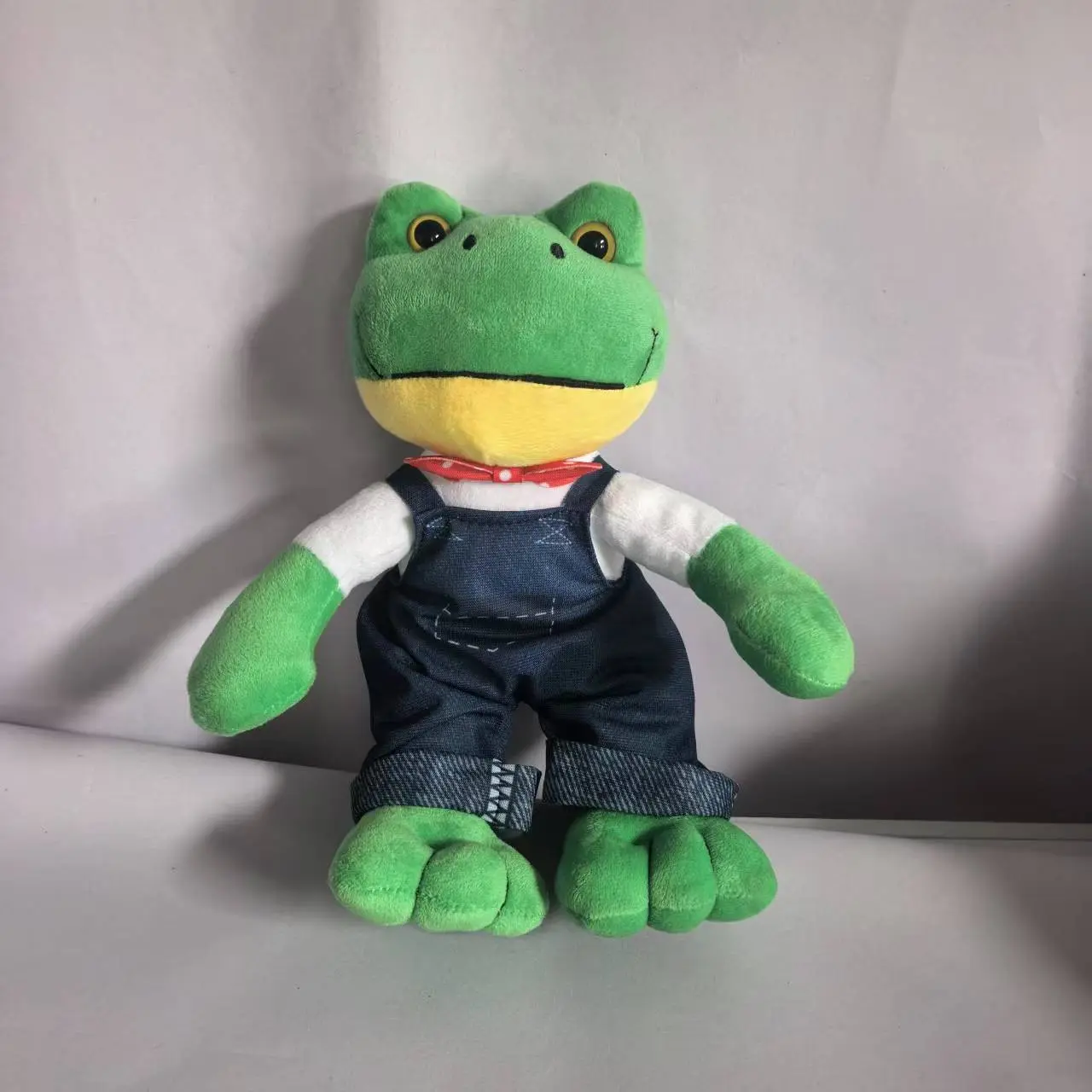 Green Plush Musical Frog Toy with Bow Tie & Overalls, Cute Stuffed Toy, Huggable Stuffed Animal, Ideal Gift for Kids