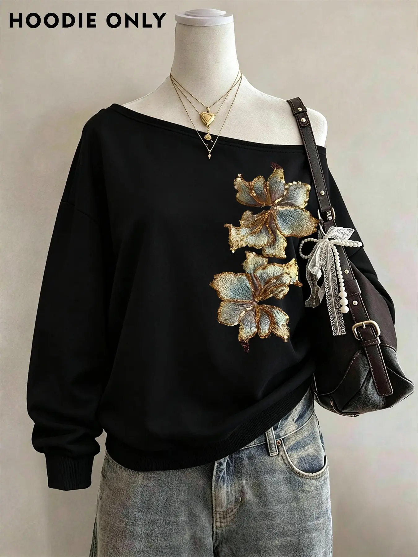 Fashionable off-shoulder black sweatshirt with luxurious gold floral embroidery, trendy and elegant casual street style, perfect for everyday gatherings, dates, weekend outings, and home wear #AutumnOutfit #OffShoulderTop #FloralEmbroideredSweatshirt