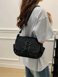 Workwear-style lace-up flap shoulder bag and crossbody bag, featuring a highly recognizable 3D crisscross lace-up design, side pockets to storage space, and an adjustable shoulder strap for long-term comfort without shoulder pressure. The flap closure sec