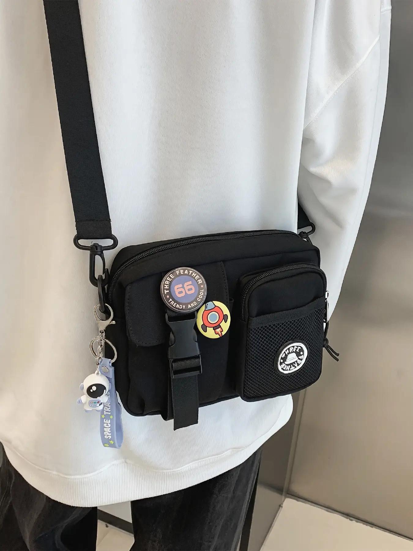 Unisex Casual Plain Color Release Buckle Crossbody Bag with Astronaut Charm, Fashionable Versatile Zipper Crossbody Bag with Random Color Badge, Trendy Shoulder Bag for Daily Use, Casual Messenger Bags, Stylish Crossbody Bags