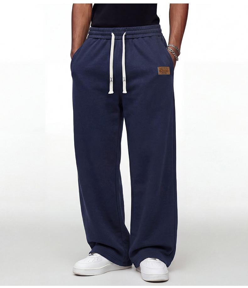 Black loose men’s sweatpants, extremely comfortable for everyday wear, skin-friendly men’s joggers, super comfortable with an elastic waistband, classic drawstring men’s casual sweatpants, suitable for various occasions, and perfect for wearing in spring
