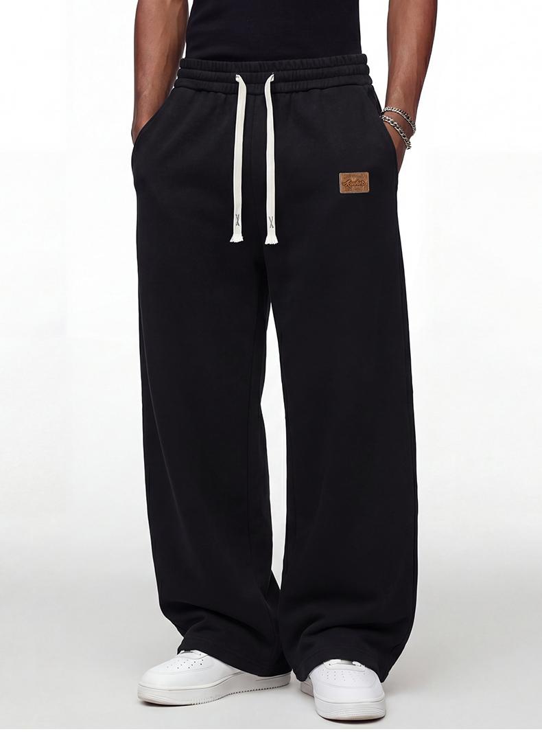 Black loose men’s sweatpants, extremely comfortable for everyday wear, skin-friendly men’s joggers, super comfortable with an elastic waistband, classic drawstring men’s casual sweatpants, suitable for various occasions, and perfect for wearing in spring