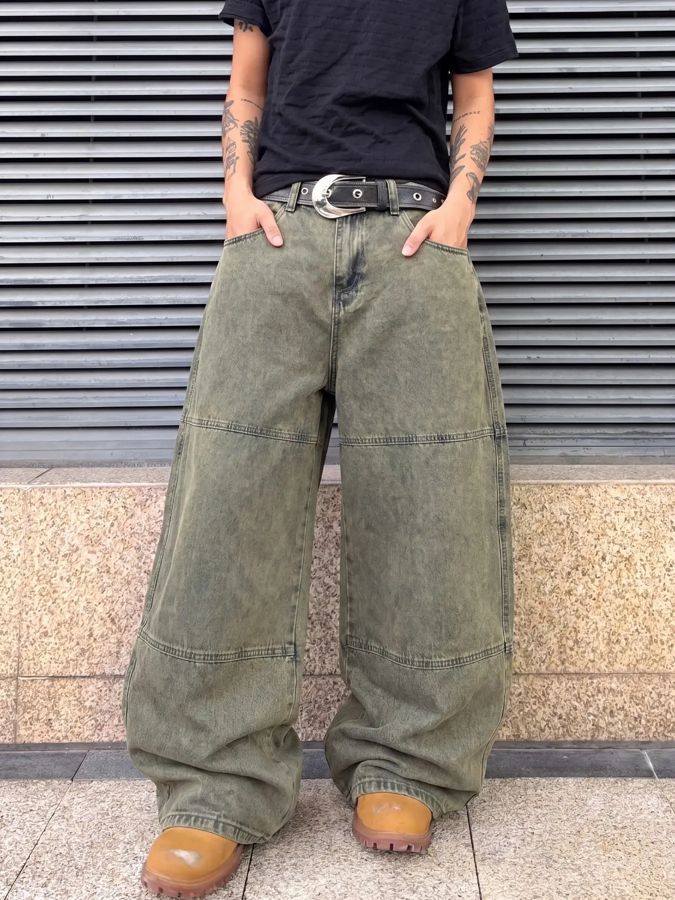 Men's vintage all-season relaxed loose curved-seam denim jeans, muddy yellow washed three-dimensional patchwork, reinforced topstitching, street tech-wear trousers.