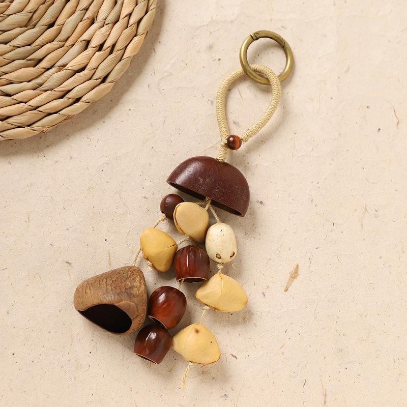 Naturally handcrafted fruit shell bell, with seeds, sound therapy handbell, wish-fulfilling fruit bag ornament, Yunnan specialty gift, mobile phone decoration accessory
