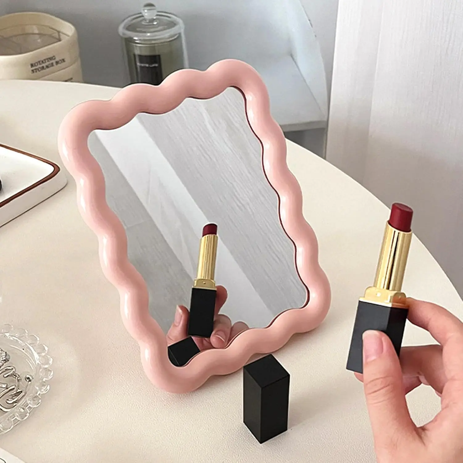 Soft wavy foldable vanity mirror with dual-use design: stand on table or hang on wall. Slim foldable structure easy to pack for trips, chic wavy outline as lovely decor mirror for bedrooms and student dorms.