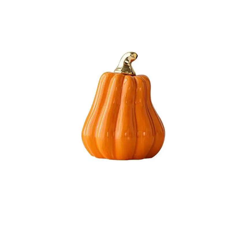 Single polished ceramic pumpkin ornament, with golden stem. Available in two color options: orange and white. A great home item for the autumn harvest atmosphere, and a fun decorative item for the tabletop during Halloween and Christmas.