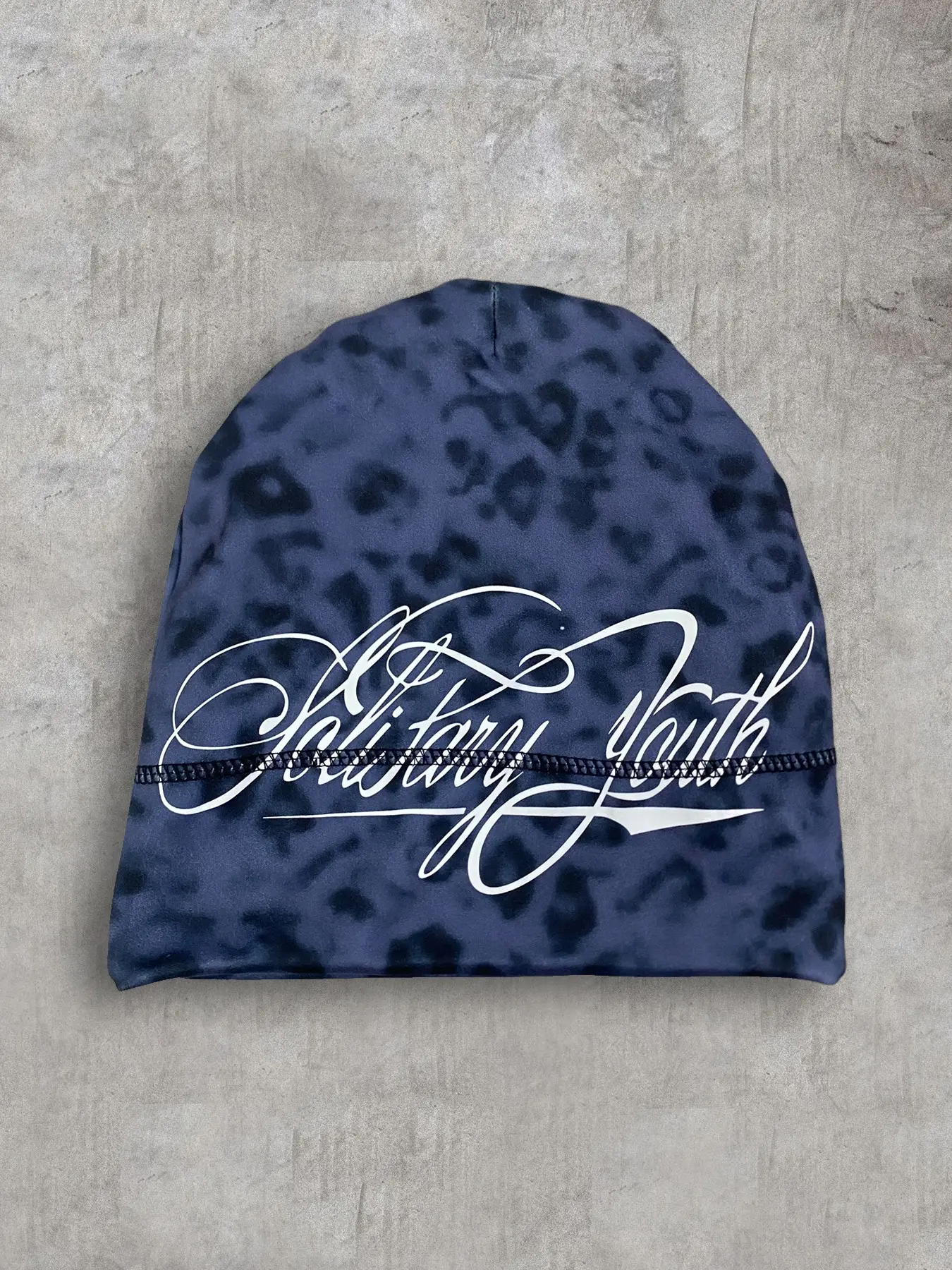 A hip-hop leopard print camouflage spliced letter printed hat for autumn and winter, cold proof pullover cap for both men and women
