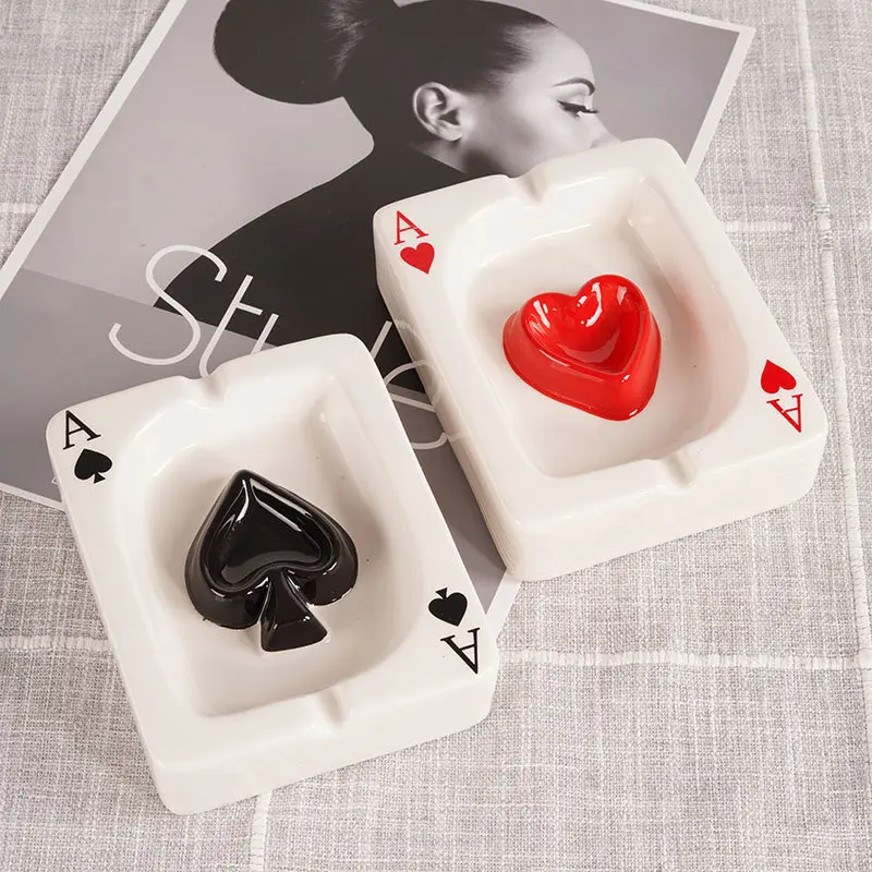 Set of 2 ceramic ashtrays  designed to prevent ash from scattering. Ashtrays in the shape of Ace of Spades, Ace of Hearts, Ace of Diamonds, and Ace of Clubs. Suitable for home use; also portable ashtrays for use at hotels, bars, and offices. Ideal as gif