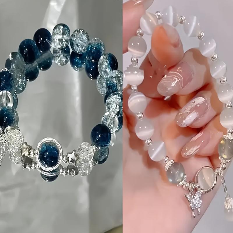 An elegant glass bead bracelet featuring a star pendant-a sophisticated, faux cat's-eye style accessory suitable for women and individuals aged 15 and up. Perfect for Valentine's Day, Carnival, and Christmas parties.