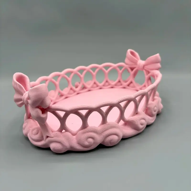 Bow Cloud Hollow-Out Oval Storage Tray, Featuring an Elegant Side Bow And a Decorative Swirl Base, Is Perfect for Organizing Perfumes, Cosmetics, Makeup Brushes, Or Jewelry. A Sweet And Girly Vanity-Style Jewelry And Cosmetics Storage Ornament
